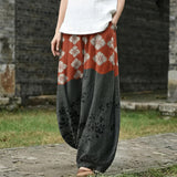 Florence – Pantalon large à motif floral orange