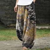 Coralie – Pantalon large doré à motif de grues et de nuages
