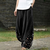 Armelle – Pantalon large noir à motifs floraux