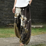 Delphine – Pantalon large blanc à motifs floraux